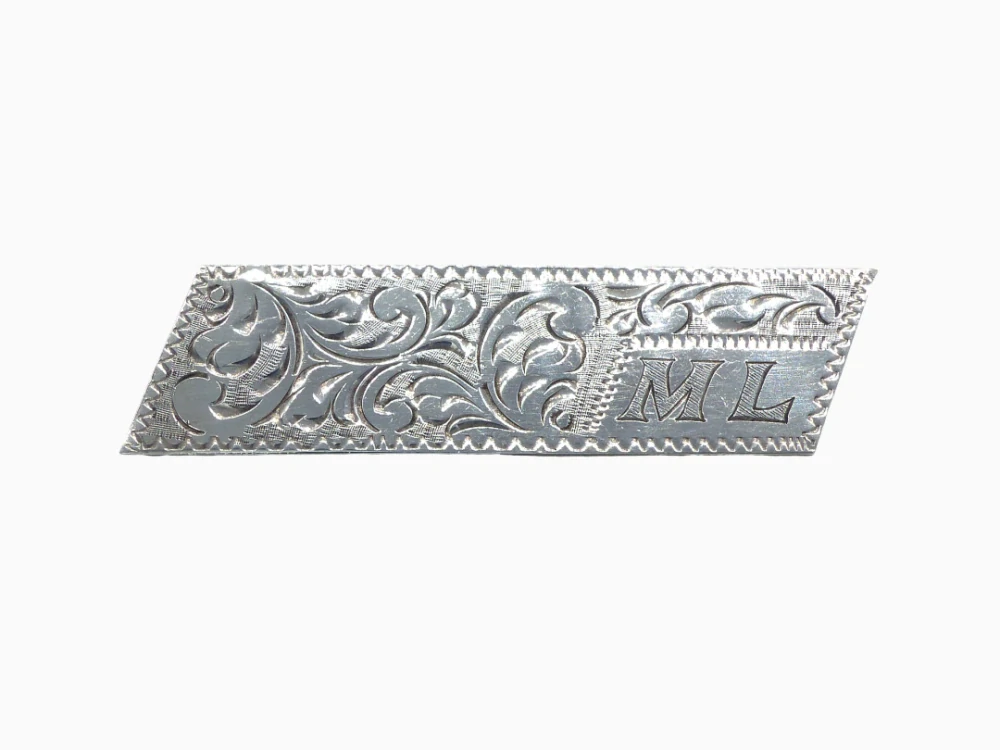 Stříbrná brož 7g monogram ML
