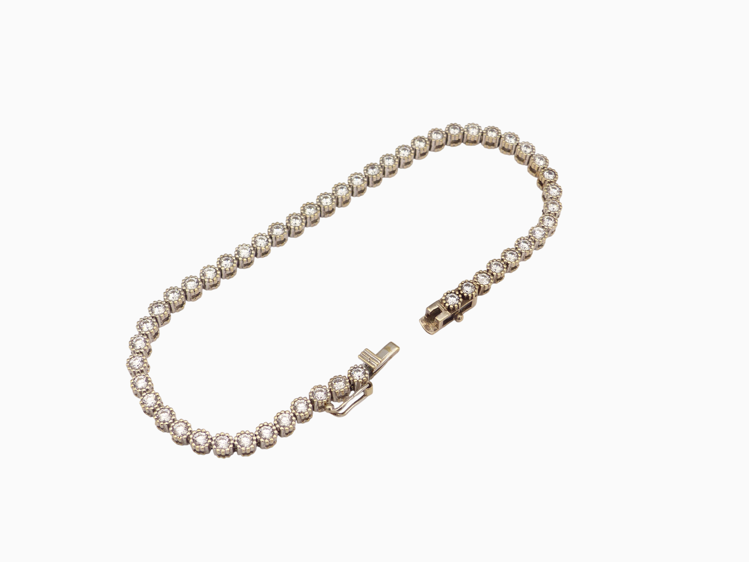 Zlatý tenisový náramek 12,30g délka 19,5 cm
