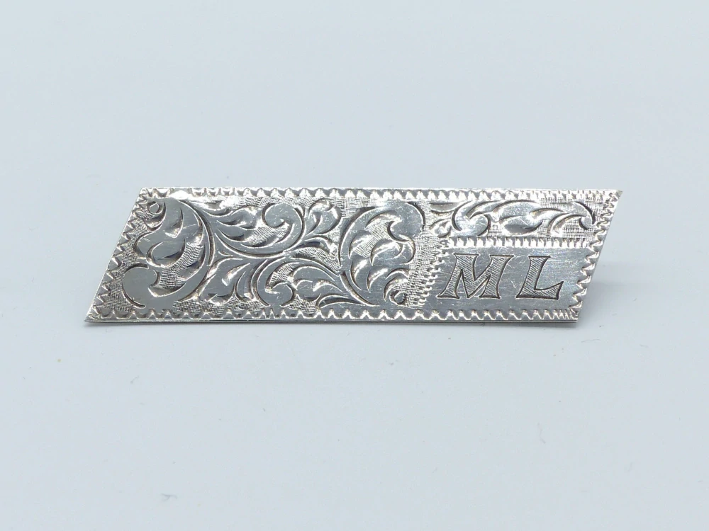Stříbrná brož 7g monogram ML
