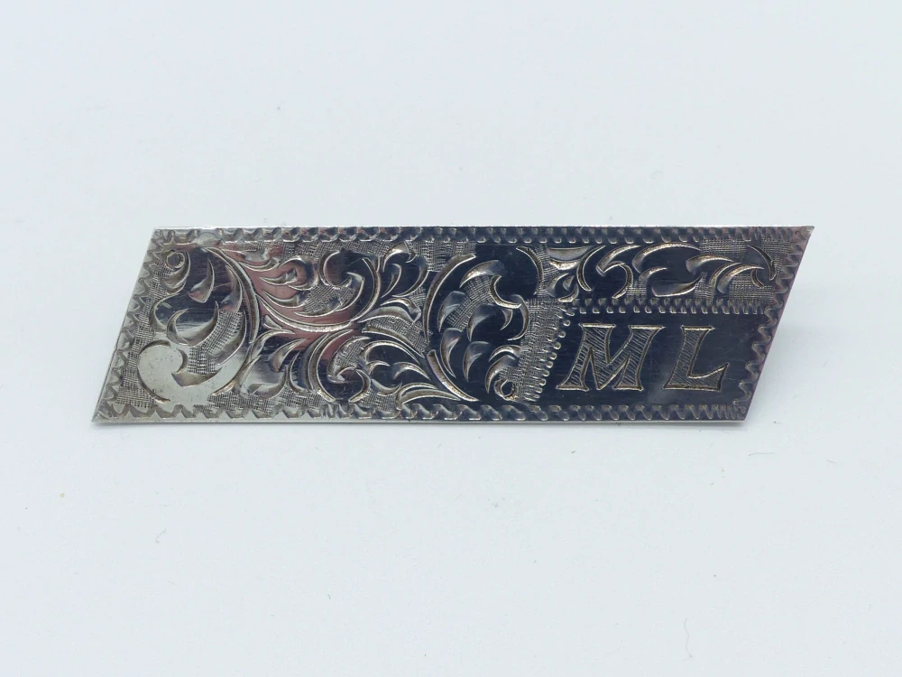 Stříbrná brož 7g monogram ML